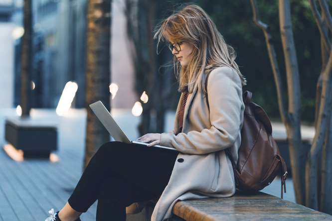 Photo of a woman working on her laptop